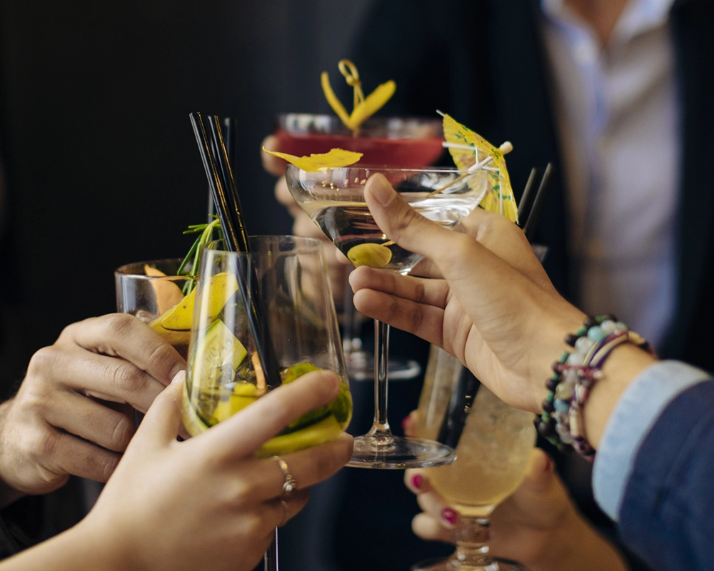 colleagues toasting with cocktails in a bar 2026 03 09 06 35 41 utc 1